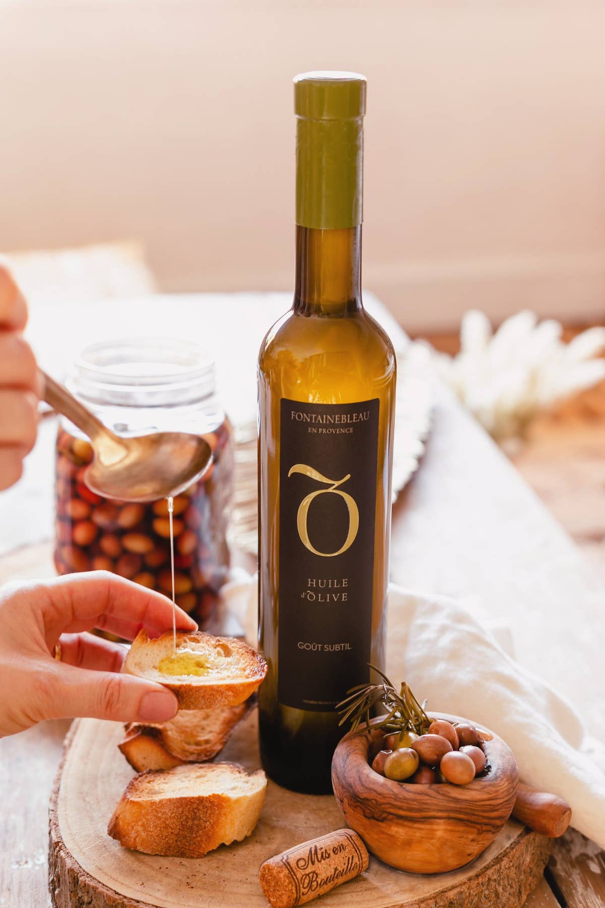The estate’s organic olive oil served with bread and olives